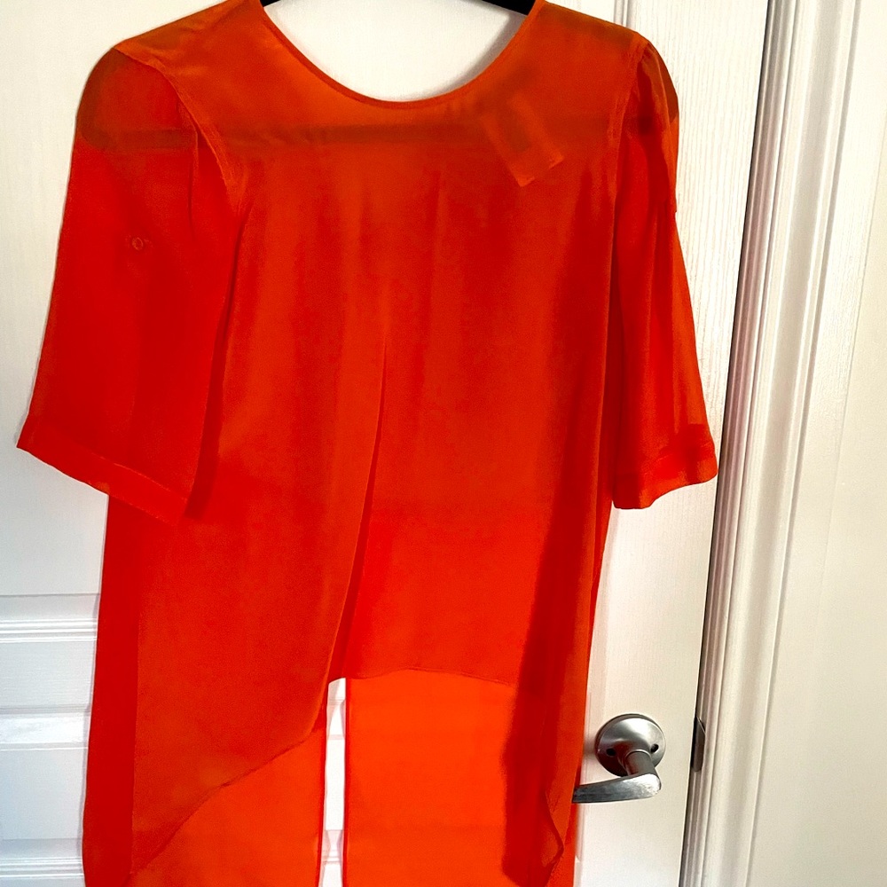 Bright orange sheer blouse
